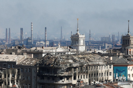 A view shows a plant of Azovstal Iron and Steel Works company behind buildings damaged in the course of Ukraine-Russia conflict in the southern port city of Mariupol, Ukraine April 7, 2022. 
