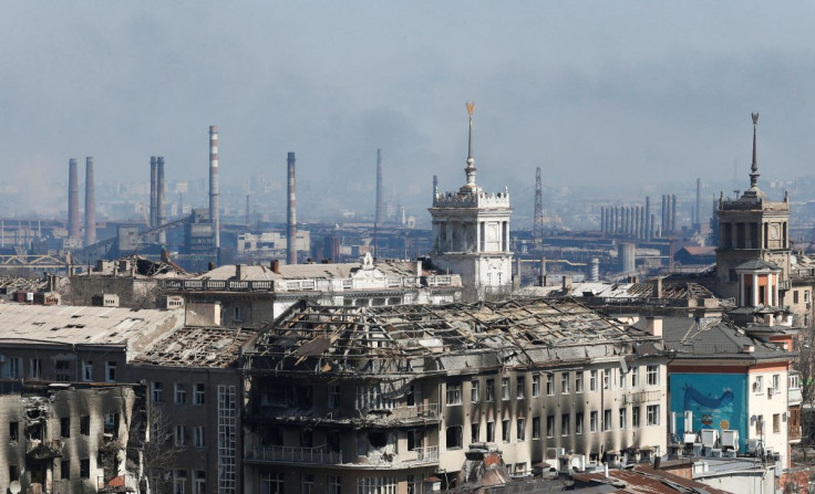 A view shows a plant of Azovstal Iron and Steel Works company behind buildings damaged in the course of Ukraine-Russia conflict in the southern port city of Mariupol, Ukraine April 7, 2022. 