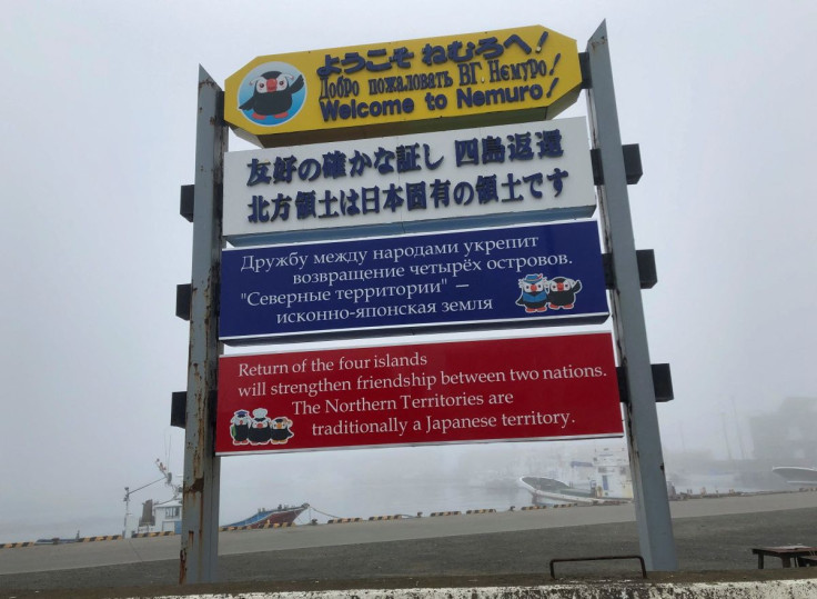 Signs demanding the return of a group of islands, called the Northern Territories in Japanese and the Kuril Islands in Russian, are displayed at Hanasaki Port, in Nemuro on Japan's northern island of Hokkaido April 12, 2022. Picture taken April 12, 2022.