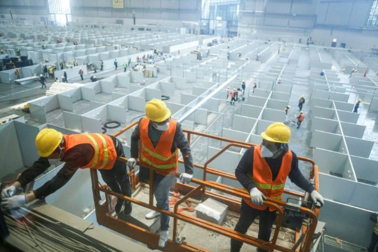 Authorities are rushing to construct tens of thousands of beds to house Covid-19 patients as daily infections top 20,000