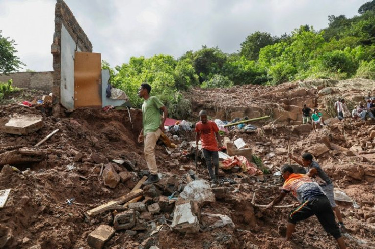 More than a dozen South African rescue workers on Friday painstakingly combed a lush green valley where 10 people from Hlophe's family have been missing for five days since violent floods tore through Durban city, killing 395 people