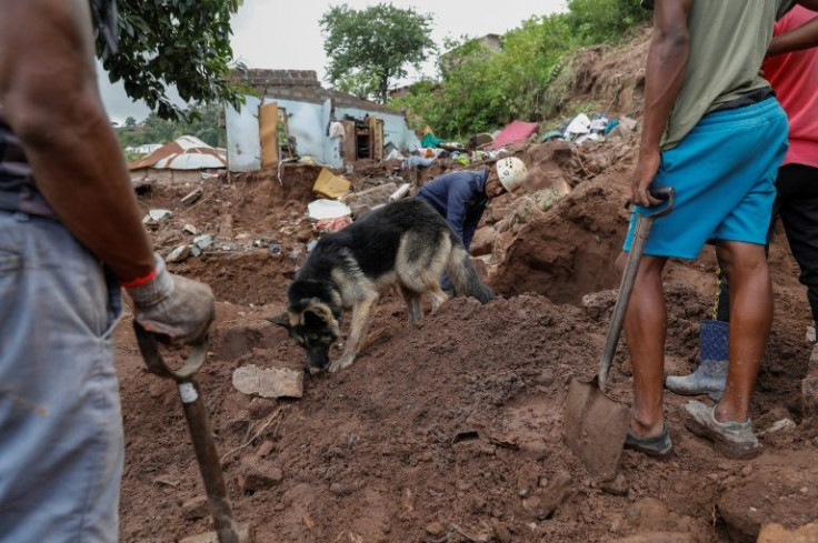 An officer warns that the sandy soil will make it harder for the dogs to trace the scent of bodies
