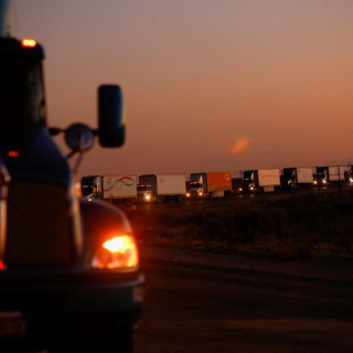 Trucks wait in a queue to cross into the United States in the Jeronimo-Santa Teresa International Bridge connecting the city of Ciudad Juarez to Santa Teresa, Nuevo Mexico, after Texas Governor, Greg Abbott announced that traffic commercial trucks from Chihuahua to Texas will return to normal immediately after a border security agreement with the governor of the Mexican state, in Ciudad Juarez, Mexico April 14, 2022.