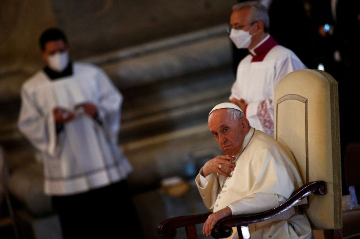 Pope Francis looks on ahead of the Easter Vigil in Saint Peter's Basilica at the Vatican, April 16, 2022.