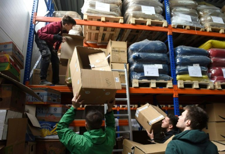 The storehouse shelves are stacked with everything from sleeping bags and tents, to flour, coffee drinks, medical gloves and soap