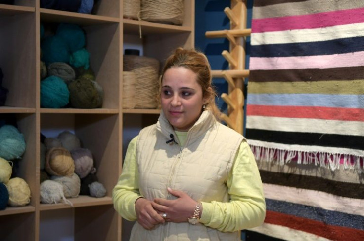 Fatima Alhamal, local coordinator for Shanti,  whose staff use an eclectic array of old clothing from the flea market, giving them a new life as rugs