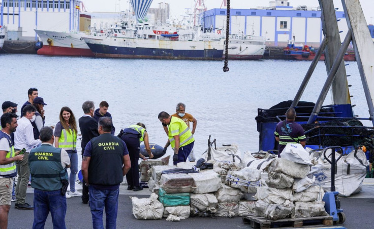 Police officers discharge drugs from the fishing boat "AKT-1" seized south of the Canary Islands in the port of Las Palmas, in the island of Gran Canaria, Spain, April 16, 2022.