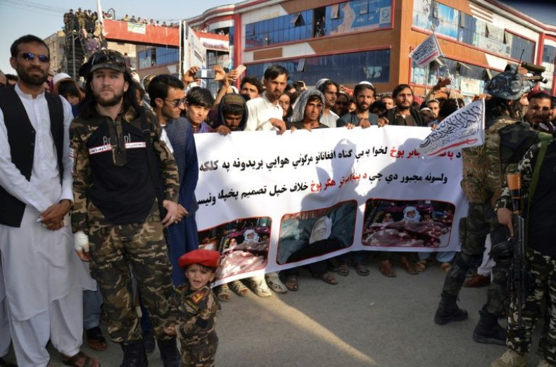 Demonstrators hold a banner during a protest against Pakistani airstrikes in Khost