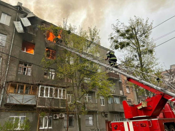 Several fires were raging in apartment blocks of Ukraine's second-largest city as Russia refocused its military efforts on its neighbour's eastern flank