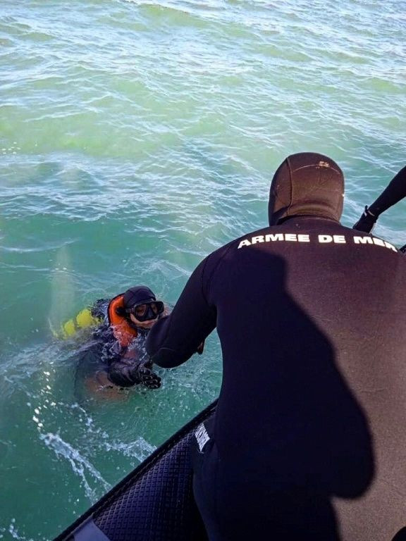 Divers from the Tunisian navy at the scene of the sunken Xelo vessel, off the Gulf of Gabes, in southeastern Tunisia