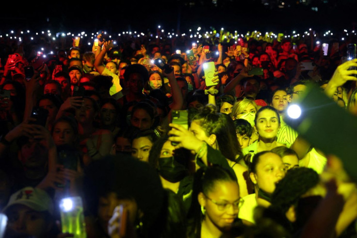People wave cell phones during a performance at the 2021 Global Citizen Live concert at Central Park in New York, U.S., September 25, 2021.  