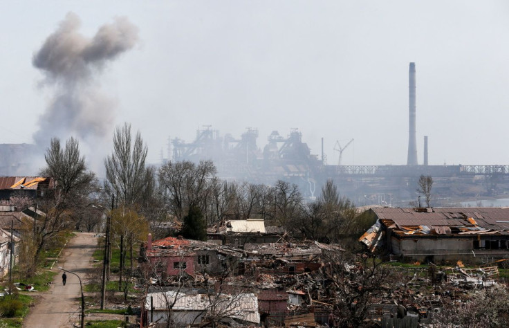 Smoke rises above a plant of Azovstal Iron and Steel Works company and buildings damaged in the course of Ukraine-Russia conflict in the southern port city of Mariupol, Ukraine April 18, 2022. 