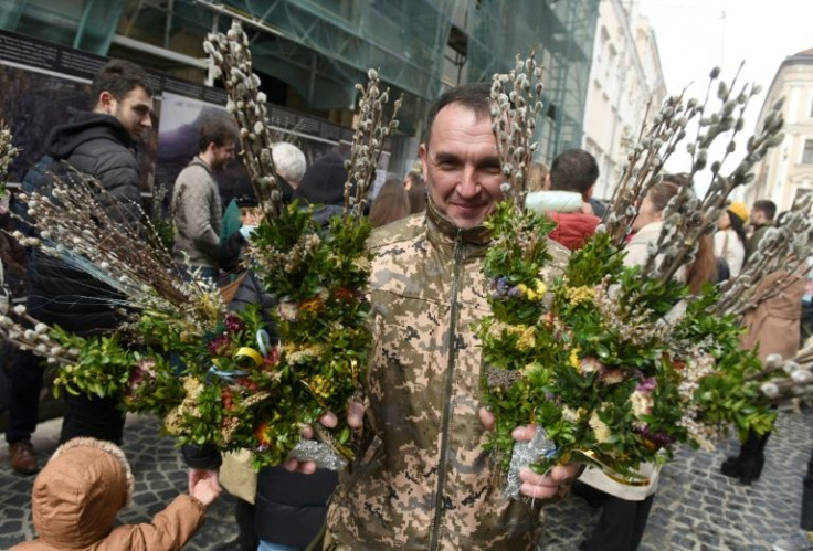 A Ukrainian serviceman  takes part in an Orthodox Palm Sunday service in Lviv