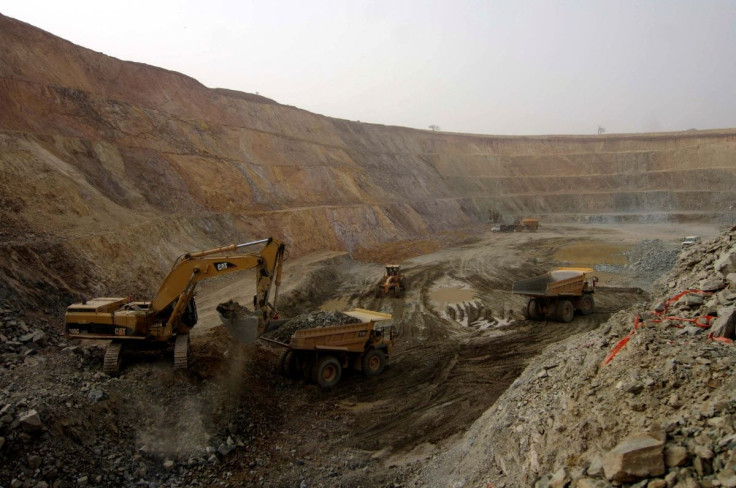 A shovel scoops up earth from one of two active pits at the Taparko-Bouroum gold mine site in northern Burkina Faso March 11, 2009.
