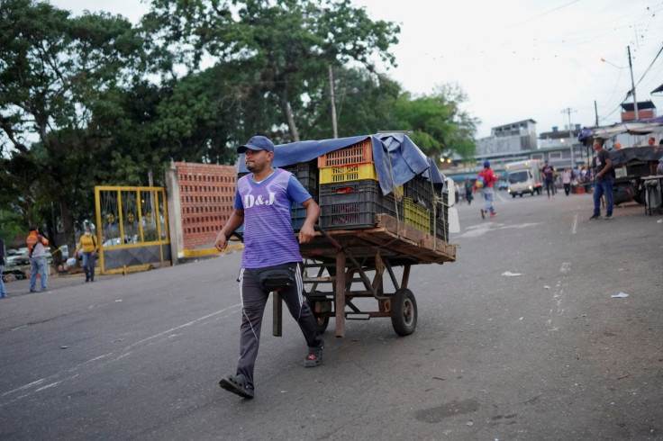 A man pulls a cart with vegetables on a street in San Cristobal, Venezuela, April 7, 2022. Picture taken April 7, 2022.