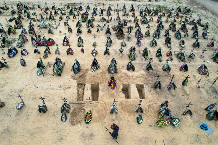 A view of at least three rows of new graves for people killed during Russia's invasion of Ukraine, at a cemetery in Irpin, Kyiv region, Ukraine April 18, 2022. Picture taken with a drone.