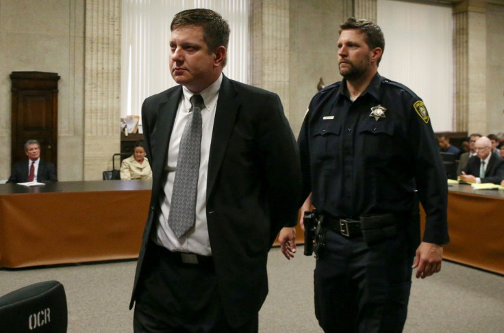 Chicago police Officer Jason Van Dyke is lead away after his guilty verdict in his murder trial in the shooting death of Laquan McDonald, in Chicago, Illinois, U.S., October 5, 2018. Antonio Perez/Chicago Tribune/Pool via