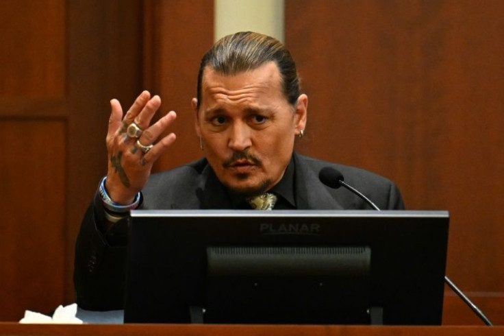US actor Johnny Depp testifies during his defamation trial in Fairfax County Circuit Court in Fairfax, Virginia
