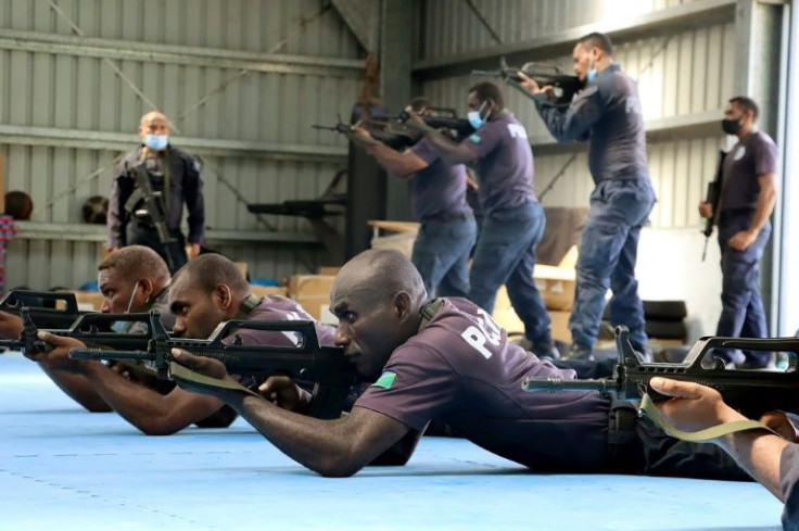 Chinese police officers training some of their Solomon Islands counterparts