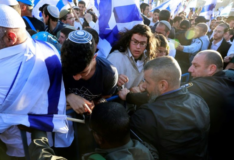 Ultranationalist Israeli protesters scuffle with  police, who barred their path to Jerusalem's Muslim quarter on Wednesday