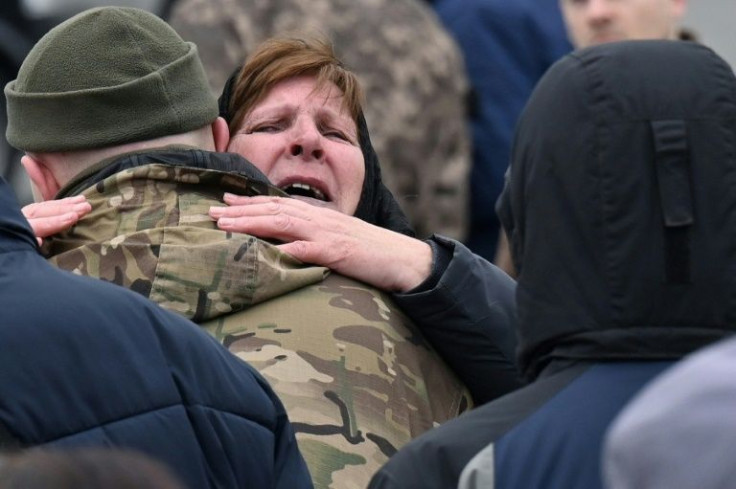 Mother of Volodymyr Karas, a Ukrainian serviceman who died during the fighting with Russian troops, reacts during the funeral ceremony at Independence square in Kyiv, on April 20, 2022