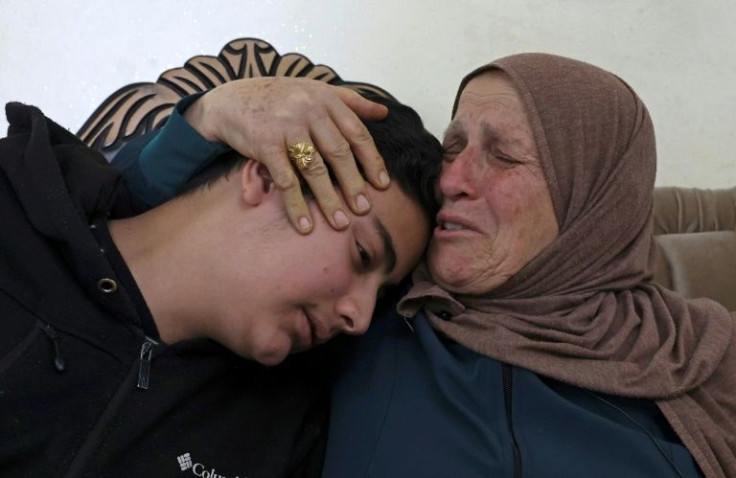 Houria Sabatien, whose daughter Ghada was shot by an Israeli soldier on April 10, mourns with her grandchild