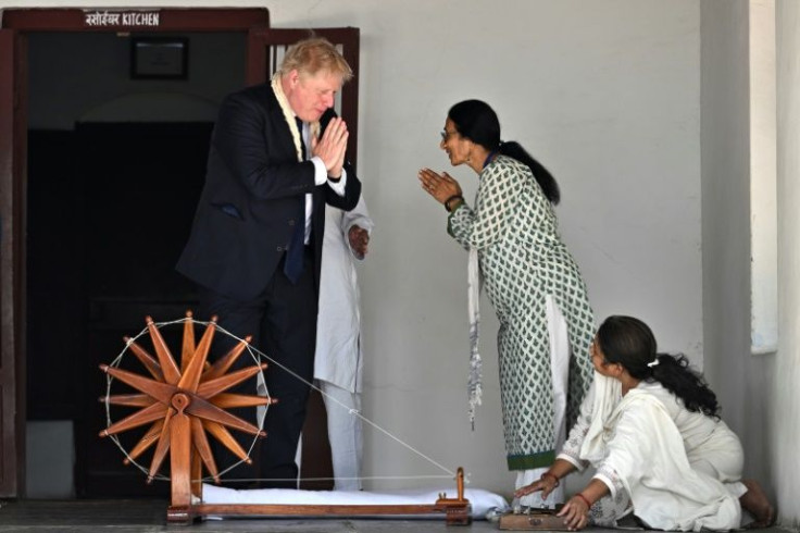 British Prime Minister Boris Johnson (L) visits the Sabarmati Ashram in Ahmedabad