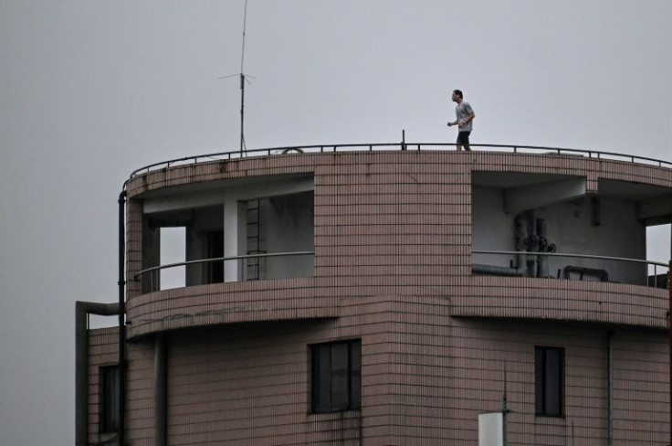 Some of the megacity's residents are finally allowed to venture outside their apartments after a gruelling Covid lockdown