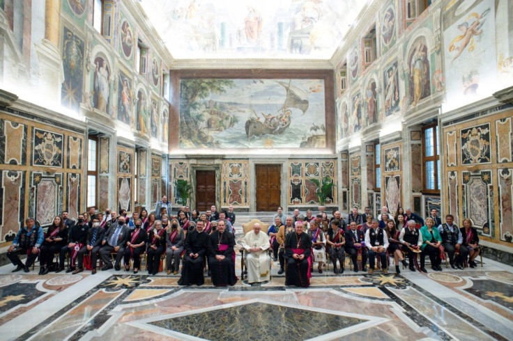 Delegates from the Manitoba Metis Federation pose for a group photo with Pope Francis during a meeting at the Vatican, April 21, 2022. Vatican Media/Â­Handout via REUTERS  