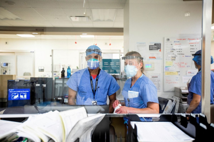 Emergency room nurse Janelle Van Halteren, right, speaks with her colleague as the Omicron coronavirus variant continues to put pressure on Humber River Hospital in Toronto, Ontario, Canada January 20, 2022. 