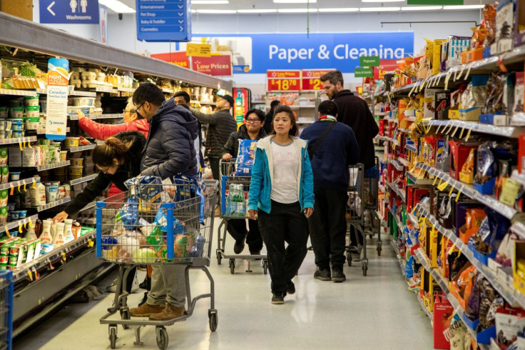 People shop at a Walmart Supercentre in Toronto, Ontario, Canada March 13, 2020.