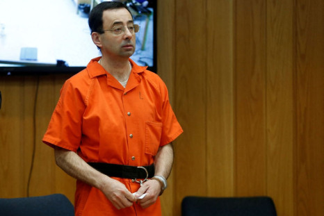 Larry Nassar, a former team USA Gymnastics doctor who pleaded guilty in November 2017 to sexual assault charges, stands in court during his sentencing hearing in the Eaton County Court in Charlotte, Michigan, U.S., February 5, 2018.  