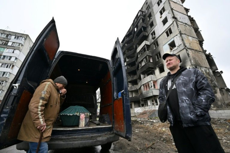 Investigators are exhuming bodies as an effort intensifies to probe war crimes accusations against invading Russian troops