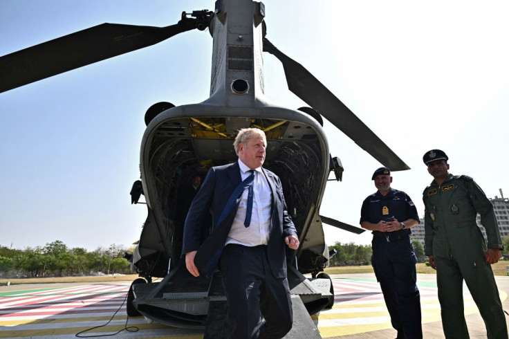 Britaish Prime Minister Boris Johnson disembarks from an Indian military's Chinook helicopter upon his arrival in Gandhinagar, India April 21, 2022. Ben Stansall/Pool via REUTERS