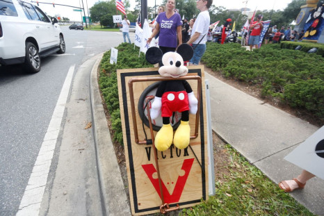 A Mickey Mouse doll is seen pinned depicting a large mouse trap while supporters of Florida's Republican-backed "Don't Say Gay" bill that bans classroom instruction on sexual orientation and gender identity for many young students gather for a rally outsi