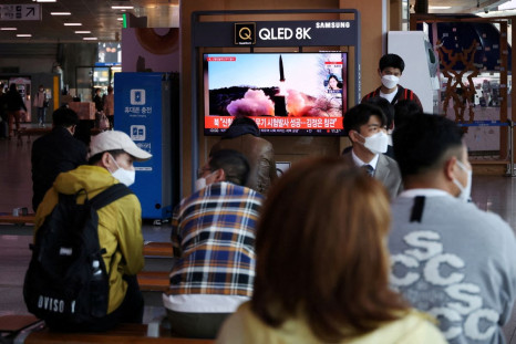 People watch a television broadcasting a news report on North Korea's new type of tactical guided weapon test, at a railway station in Seoul, South Korea, April 17, 2022.   