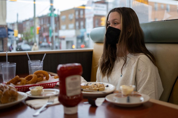 A customer dines at a restaurant as the indoor mask mandate is reinstated to prevent the spread of the coronavirus disease (COVID-19), in Philadelphia, Pennsylvania, U.S., April 18, 2022.