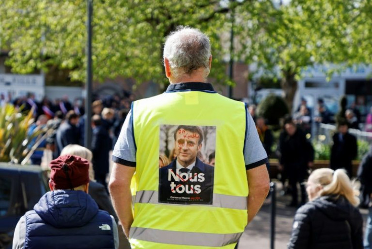 Yellow vests: A man opposed to French President President Emmanuel Macron awaits him on the campaign trail in northern France