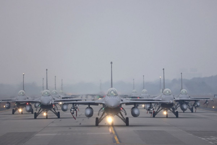 12 F-16V fighter jets perform an elephant walk during an annual New Year's drill in Chiayi, Taiwan, January 5, 2022. 