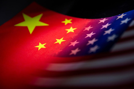 China's and U.S.' flags are seen printed on paper in this illustration taken January 27, 2022. 