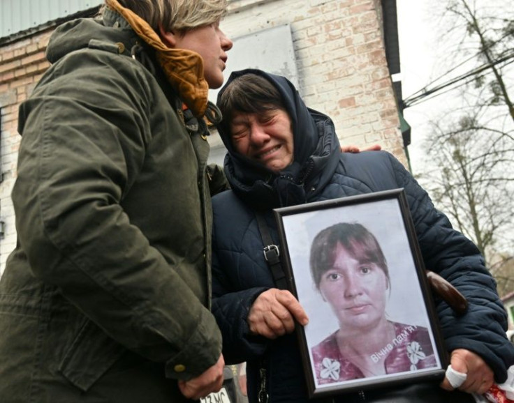 Nadia Kovalenko holds a photograph of her daughter Inna, who was killed in Bucha last month