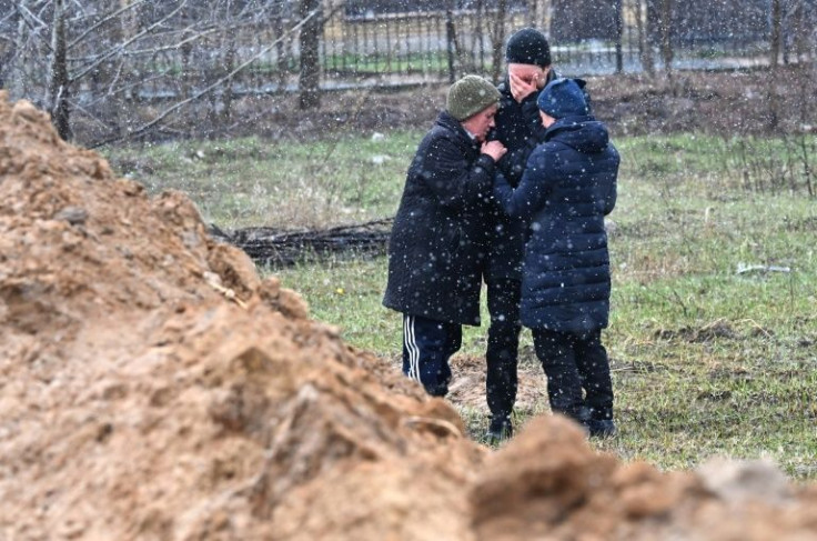 Mourners at a mass grave in Bucha earlier this month