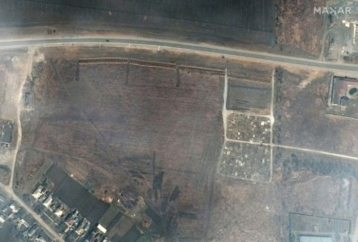 Satellite imagery released by Maxar Technologies shows an overview of a cemetery and early expansion of graves site on the northwestern edge of Manhush, Ukraine