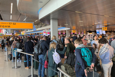 Travellers wait in lines at Amsterdam Schiphol Airport as an unannounced strike of ground staff caused many delays and cancellations, in Amsterdam, Netherlands April 23, 2022. 