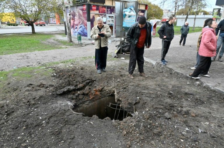 The third Russian rocket left a hole in the ground next to the pavement