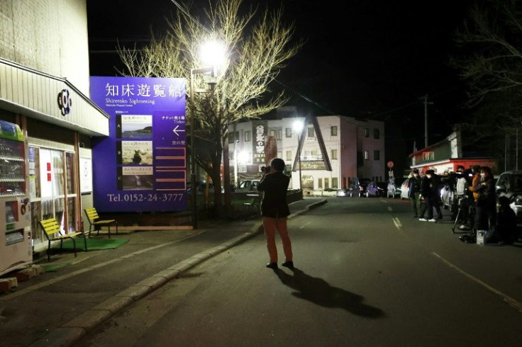 A sightseeing boat with 26 people on board is missing off Japan's Hokkaido after sending a distress signal saying it was sinking
