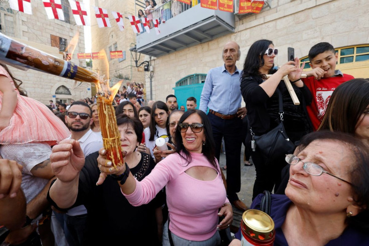 Worshipers attend the Holy Fire ceremony, outside the Church of the Nativity in Bethlehem, in the Israeli-occupied West Bank April 23, 2022.