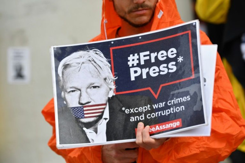 Julian Assange's supporters accusing Washington of trying to muzzle reporting of legitimate security concerns