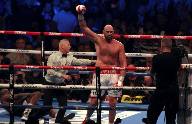 Britain's Tyson Fury celebrates victory against Dillian Whyte to retain the WBC heavyweight title at Wembley Stadium