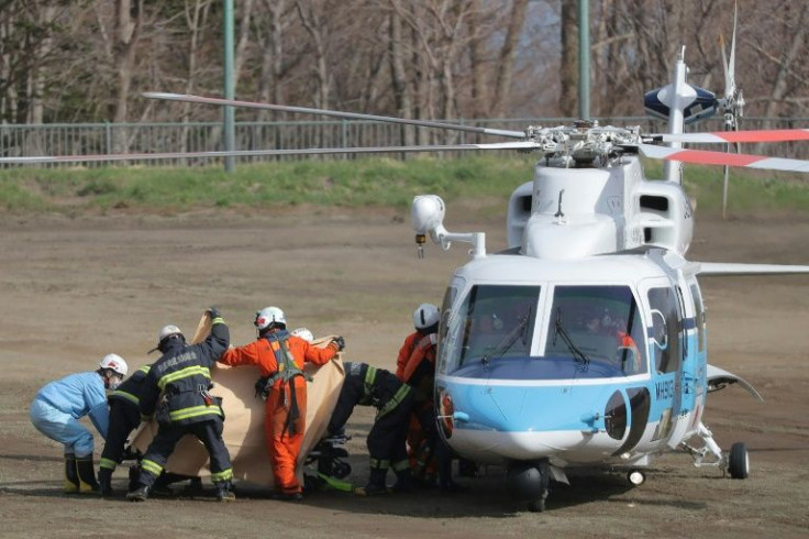 Rescuers have found several people missing from a sightseeing boat that sank off Japan's northern coast